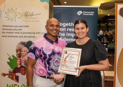 Anti-Discrimination Commissioner Jeswynn Yogaratnam presents the Diversity Award to the Apmere Amantye-Akeme Palliative Care team from Alice Springs