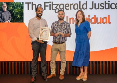 2024 - Justice award individual joint winner - Nick Espie and Ambrith Abayasekara accepting on behalf of Kevin Banbury - 2